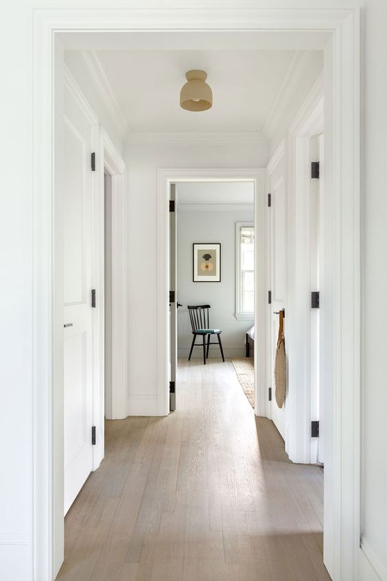 an all-neutral space with crown molding covering the doorways is a very cool solution for a modern or Scandinavian space