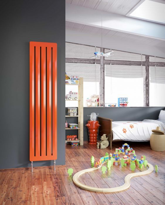 an attic kid's room with grey walls, simple modern furniture, a vertical orange radiator is a lvoely space with a touch of color