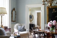 white crown molding on the ceiling, framing the windows and doorways is a lovely delicate touch that accents the wall color