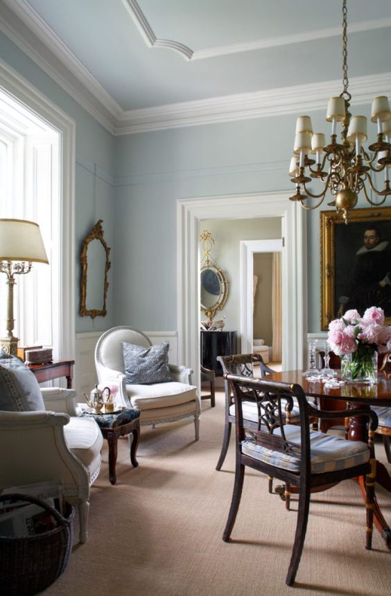 white crown molding on the ceiling, framing the windows and doorways is a lovely delicate touch that accents the wall color