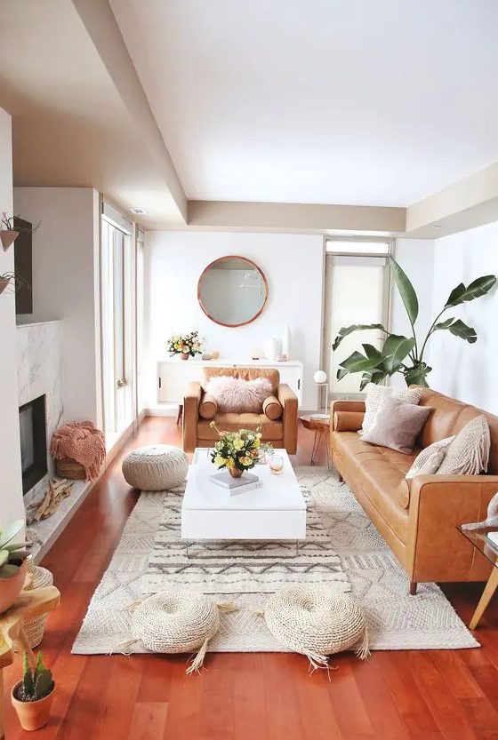 a neutral room with camel leather furniture and a tan colored ceiling for a chic look