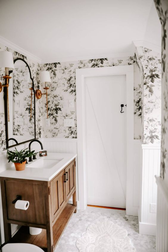a modern farmhouse bedroom renovated with botanical removable wallpaper that really gives it a character