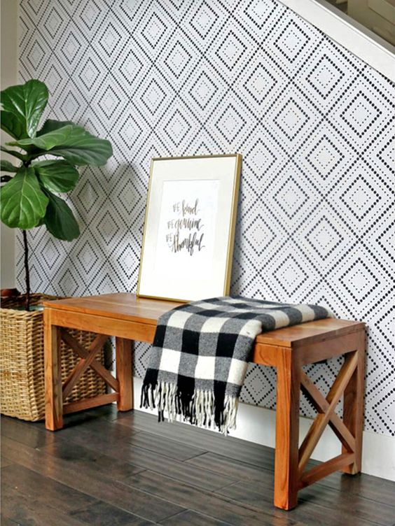give your entryway a character and much interest with cool printed wallpaper and a bit of geometry is always a good idea