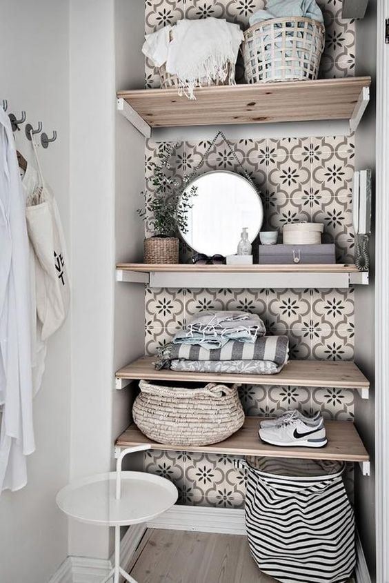 a little laundry nook with open shelving styled with tan printed tile stickers to make it more eye-catchy and chic