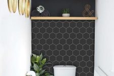 11 a small and stylish mudroom with a black wall accented with white hexagon vinyl tile stickers is amazing