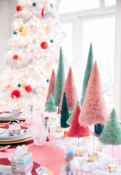 a colorful Christmas tablescape with super bright bottle brush Christmas trees, bold linens and porcelain is amazing