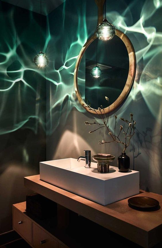 this light green pendant light gives an under the sea feel to the bathroom and makes it look unique and inspiring