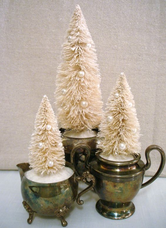 vintage tableware with faux snow and white bottle brush Christmas trees decorated with pearls make up adorable holiday decor