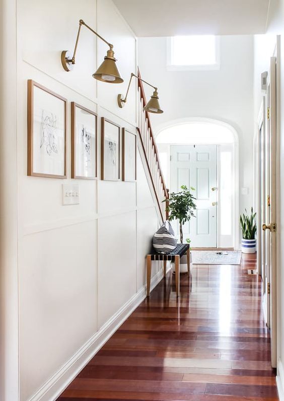 accent your mini gallery wall with elegant vintage brass sconces and your artwork will be always seen