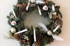 22 a lovely Harry Potter Christmas wreath with Golden Snitches, letters, pinecones, beads and Harry Potter signs