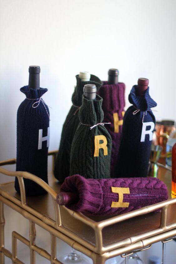 sweater wine cozies with monograms are amazing for decorating your drink cart in Harry Potter style