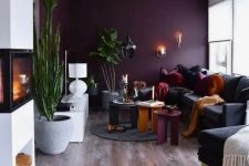 a dramatic living room with a purple wall