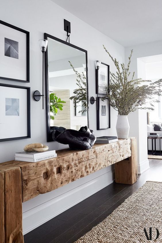 a gorgeous rough wood slab console table for a textural and unique look in the space