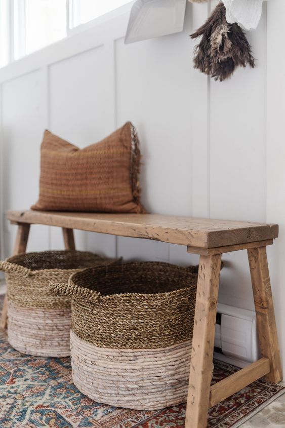 such a skinny reclaimed wood bench is a perfect addition to the rustic space and it gives coziness to the room
