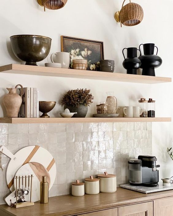 a beautiful neutral kitchen with neutral zellige tiles, light-stained shelves and cabinets is a chic and catchy idea