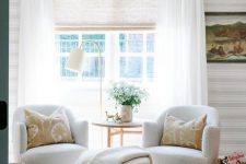 delicate semi sheer woven shades and white draperies make this window beautifully dressed and chic and add coziness to the room