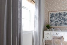 woven shades plus semi sheer grey curtains are a perfect pair for this neutral space, they add interest and chic to the room