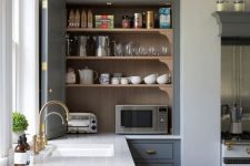 06 a kitchen cabinet with bi-fold doors hiding several appliances and various other stuff is a cool idea