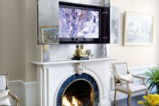 12 a fireplace and an artwork over it that hides a TV – open the doors and you will get your TV