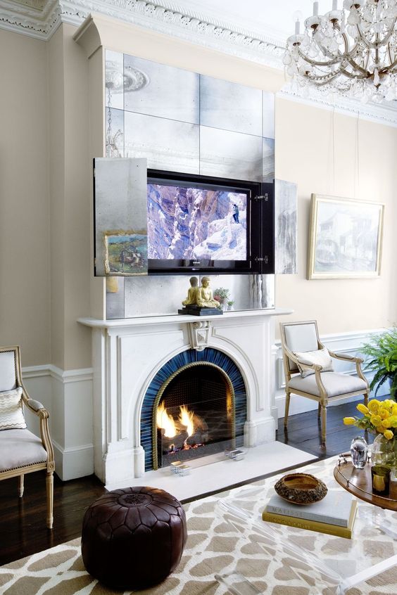 a fireplace and an artwork over it that hides a TV   open the doors and you will get your TV