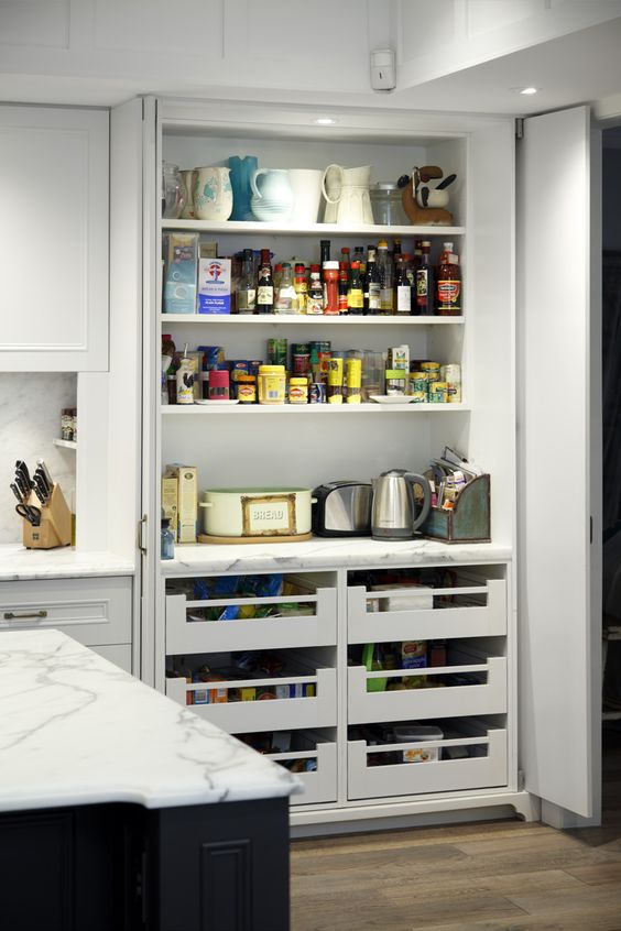 a small built-in pantry that keeps small appliances, too, and the doors are both sliding and folding to comfortably use everything