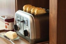 15 a small retractable shelf and a lifting up cabinet door for hiding the toaster – you can easily get it when needed