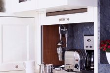 17 a tiny cabinet with a door that can go up and small kitchen appliances hidden inside is a lovely idea to achieve a sleek look