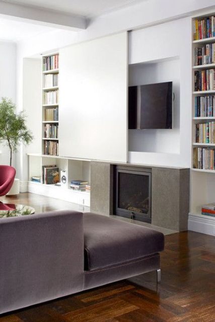 a TV hidden under a white screen that imitates the wall is a clever and rather popular idea - just slide the screen and watch TV