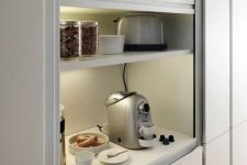 20 an open storage compartment finished with blinds is an ideal space for appliances and lights and sockets inside let you use them at once