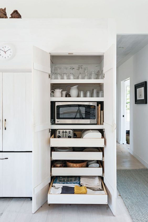 slide put pantry kitchen drawers holding appliances, tableware, glasses and other stuff is a great idea for a modern kitchen