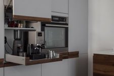 25 a cabinet with a lifting up door and retractable shelves holding various kitchen appliances is a great idea
