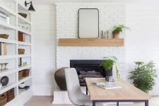 25 a cool modern country home office with a white brick fireplace, a large storage unit, a desk and a bold rug, potted plants