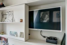 27 a TV hidden under a shelving unit that can slide and let you watch TV – this is a stylish and cool idea