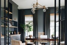 a sophisticated graphite grey home office with matching cabinets for storage an elegant stained desk and creamy chairs