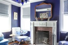 39 a fabulous very peri vintage living room with a fireplace and a vintage mantel, a catchy pendant amp and blue and purple floral print furniture