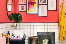 41 a unique bathroom with red walls, white tiles, pink and mustard textiles and quirky furniture and artworks