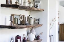 rough wood shelves in the wakward corner add a bit of rustic chic to the space, and baskets help with that, too