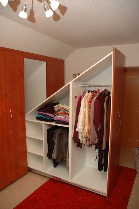 a built-in attic storage unit with oversized drawers and compartments with doors is a smart solution to rock