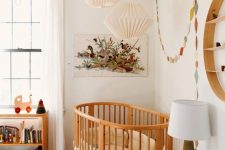 a cute mid-century modern nursery with a stained shelf, a stained crib with neutral bedding, a bold printed rug, colorful decor