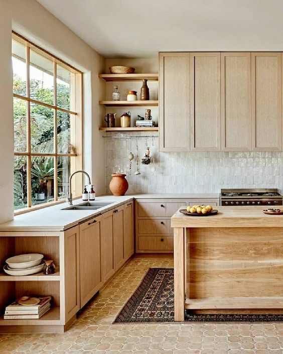 a lovely kitchen with a Zellige tiled backsplash