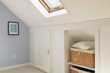 a pretty neutral attic room with built-in storage – baskets for storage and storage compartments with doors is amazing