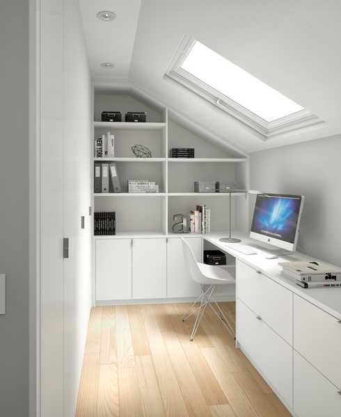 a white attic home office with a built-in storage unit, a skylight and a storgae unit with a built-in desk is a smart solution