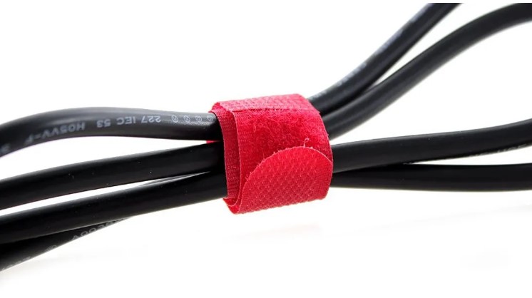 use Velcro cable ties to wrangle your cords, they are cheap and easy to remove and can be rocked to hide any cords, not only those of the TV