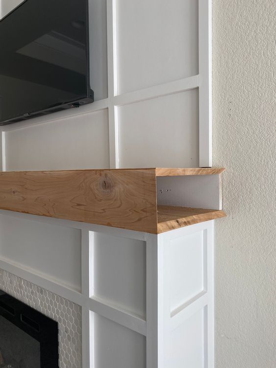 a mantel that is hollow inside can hold all the cables you want to hide, this is a very smart and cool idea