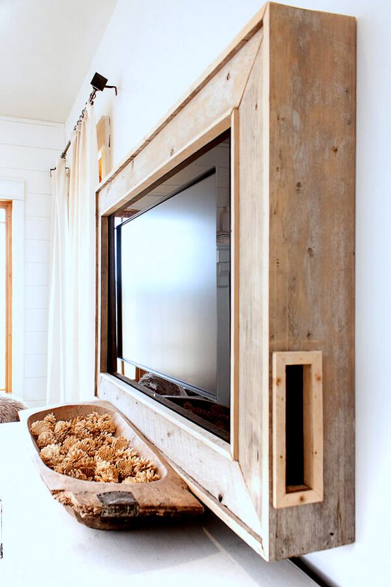 a salvaged wood frame box will hide all the wires away and will continue the rustic decor theme of your space