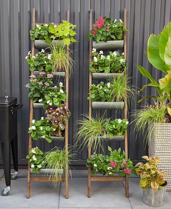 vertical tiered ladders with blooms and greenery are amazing for tight spaces, you can refresh the area easily