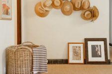 15 a whitewashed branch with hats attached to it, with ropes and pins is a beautiful arrangement for an entryway, great to add a Mediterranean touch to the space
