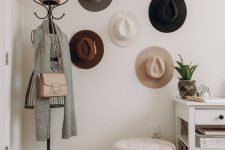 17 an entryway hat display with hooks on the walls that are hidden by the hats themselves is a lovely idea to add decorative value to the space