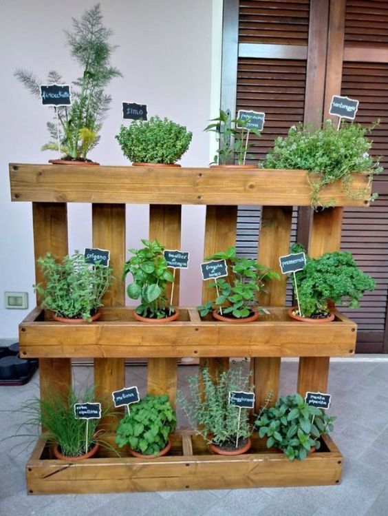 a vertical kitchen garden composed of wood, with lots of planters and chalkboard markers is a lovely idea for any small space, indoor or outdoor