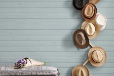 23 a creative hat holder made of a zigzag wooden plank with hooks is a lovely idea for your entryway, and hats will hide this plank